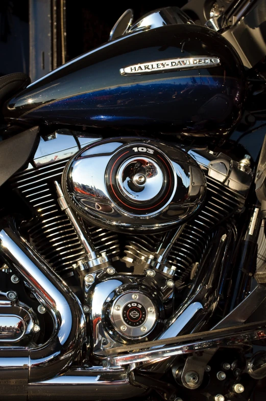 a shiny, chrome motor cycle closeup showing the exhaust pipes