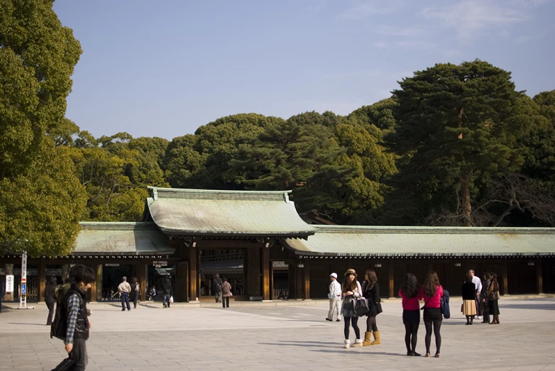 a group of people standing in front of a pavilion