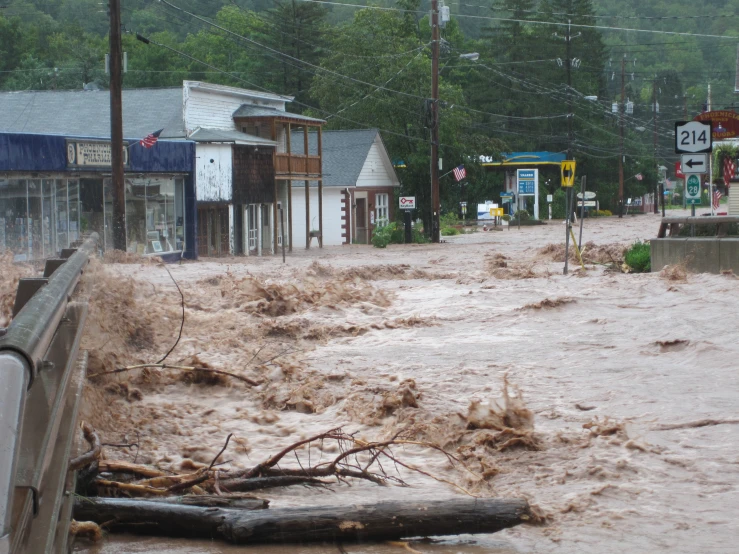 a street is flooded with water and wood