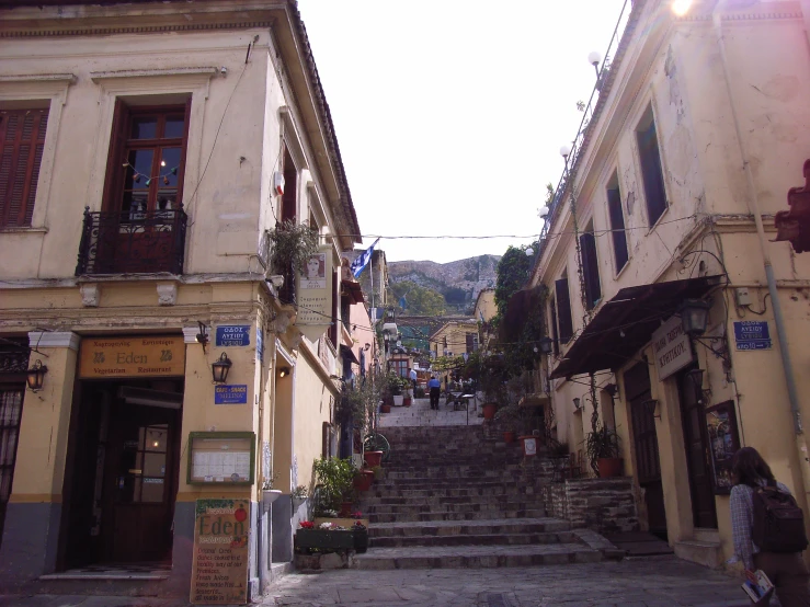 a cobblestone street with people on it