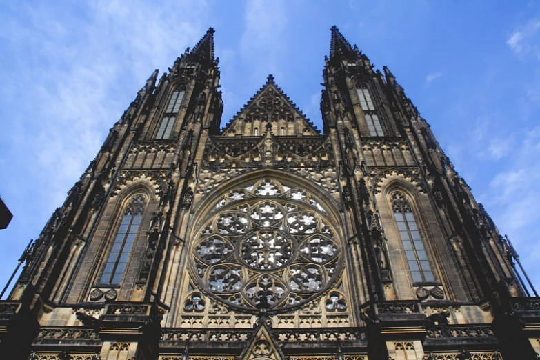 a cathedral building with a clock built into the side