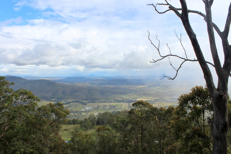 the view of the countryside from a hill side