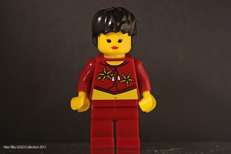 a lego character dressed in a red outfit