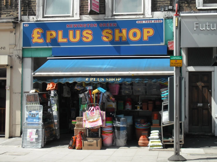 a storefront on the street advertising plus shop