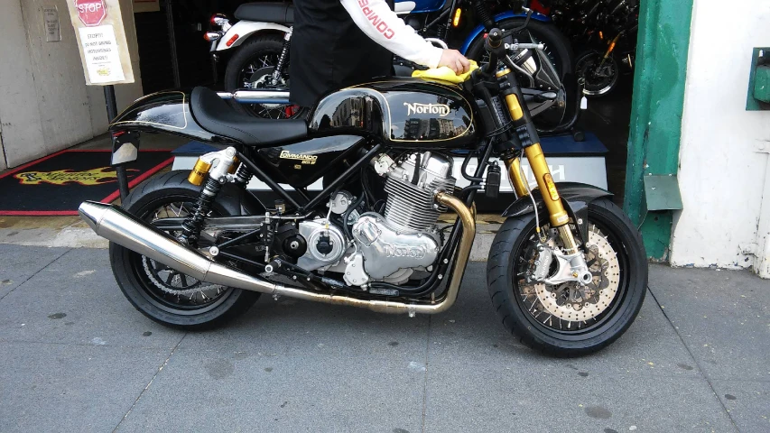 motorcycle sitting parked next to store display of bikes