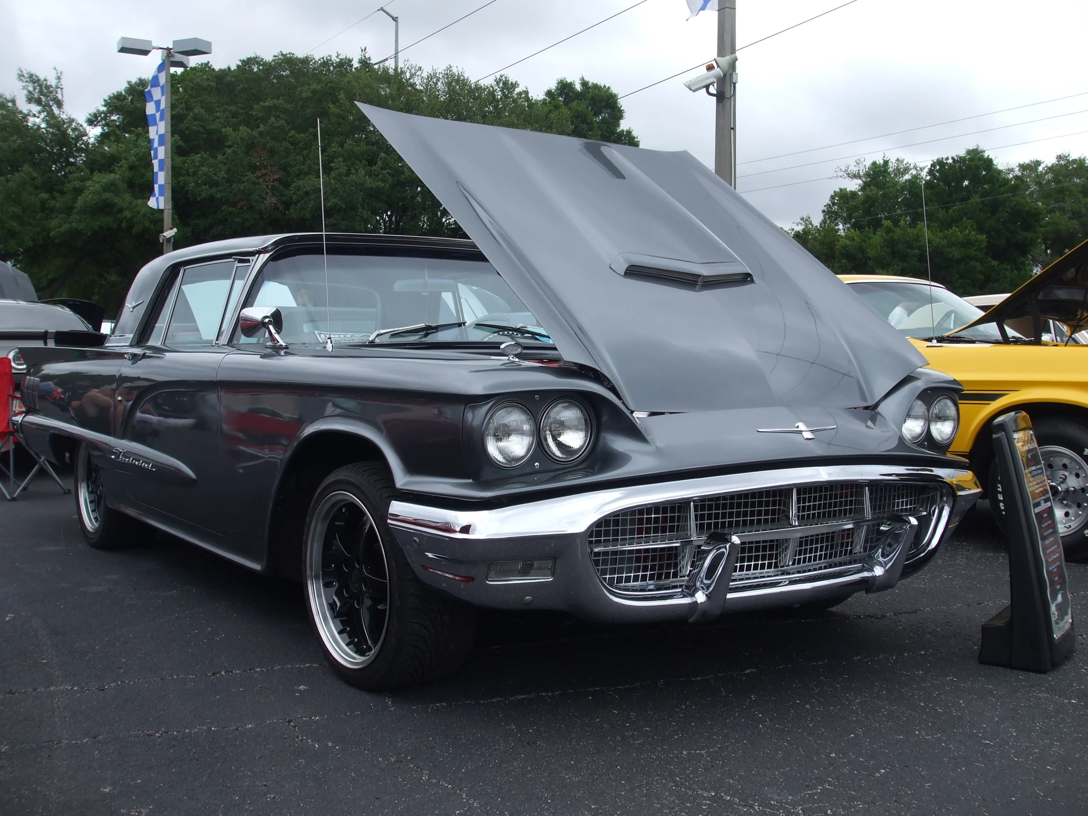 a classic car is parked in the parking lot