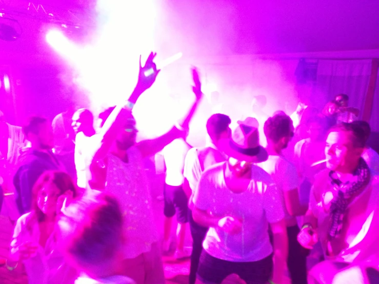 a group of people dancing at a party