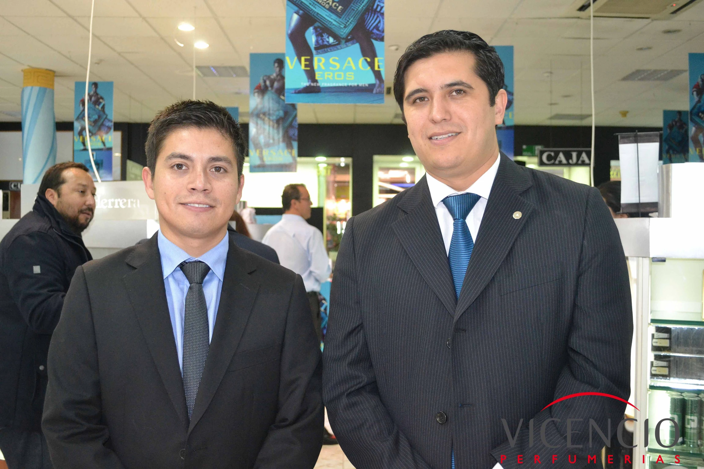 two young men are posing for a picture together