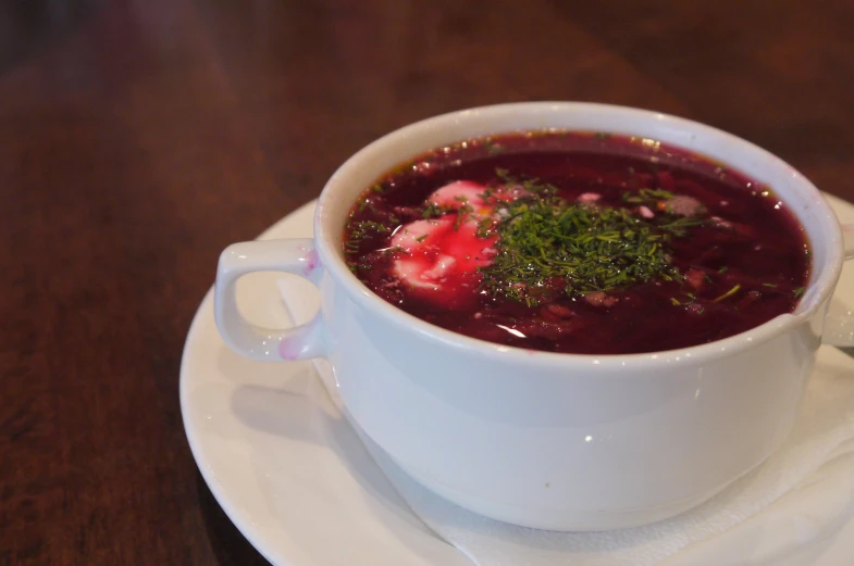 a plate with a soup and a spoon