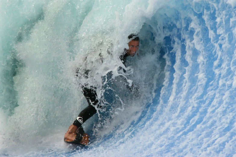 a person riding a surf board on a wave