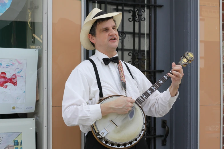 a man is holding up an instrument