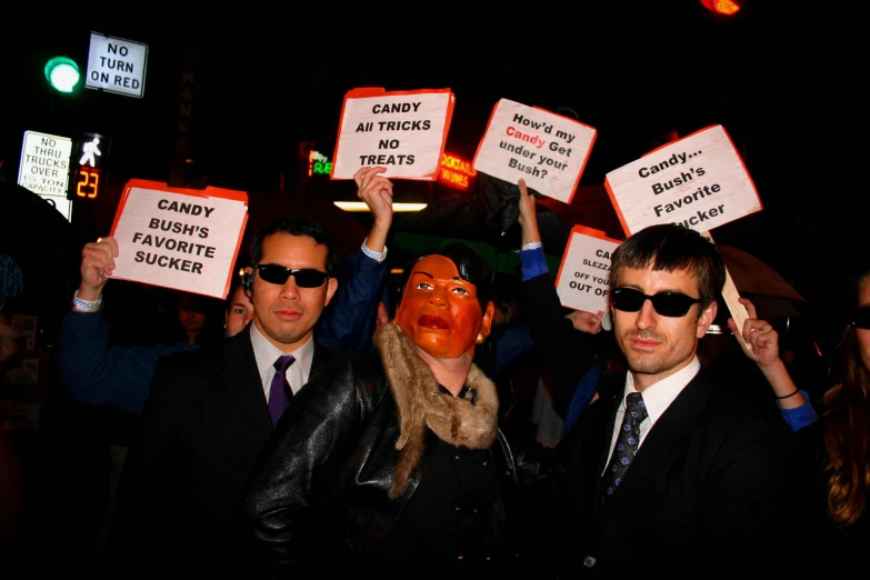 a group of people that have signs on their heads
