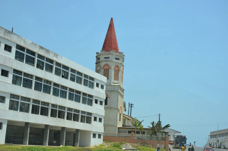 the building has a tall tower with a clock at it's top