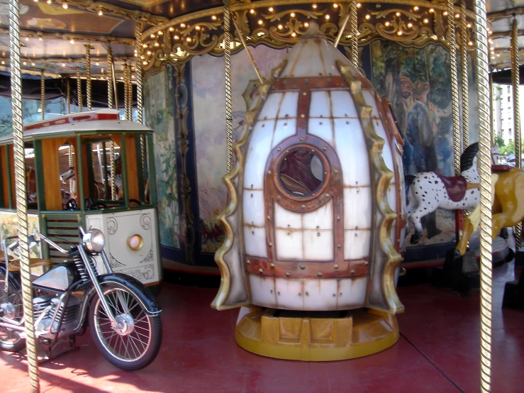 a white, round carousel on display with the theme of a circus