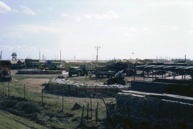 several vehicles are parked near a park in a foreign country