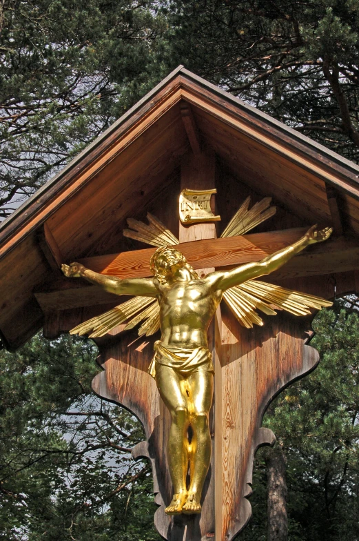 a statue on top of a wooden structure