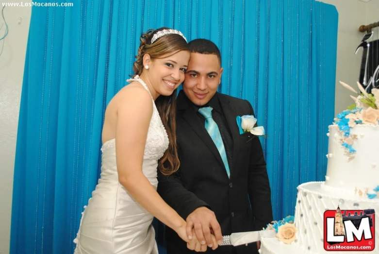 a bride and groom  a wedding cake