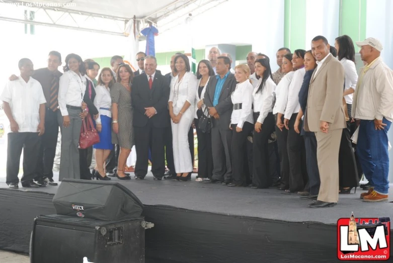 a group of people that are standing on a stage