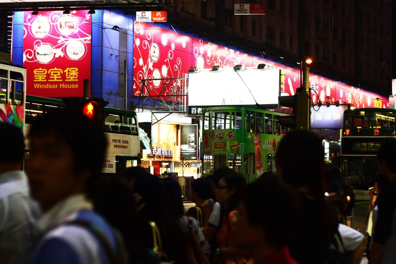 the people walk around in the busy city