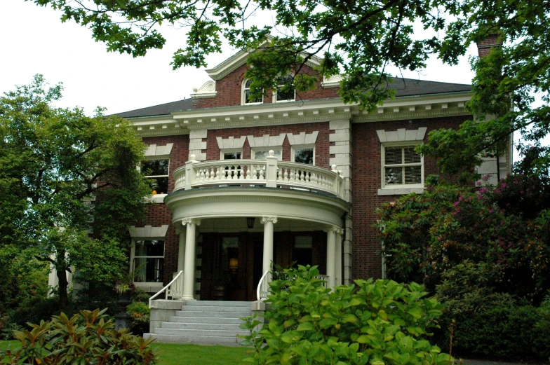 a round brick building surrounded by lots of trees