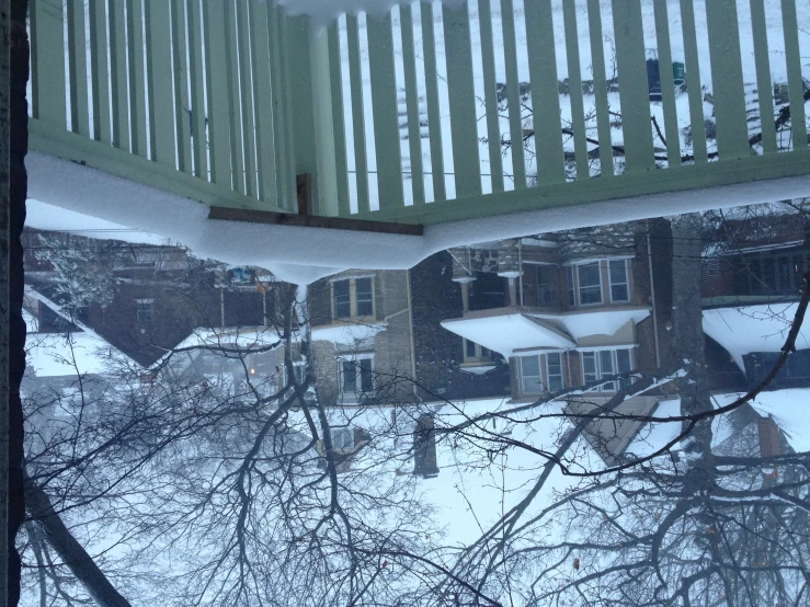 a snowy day looks down at a neighborhood