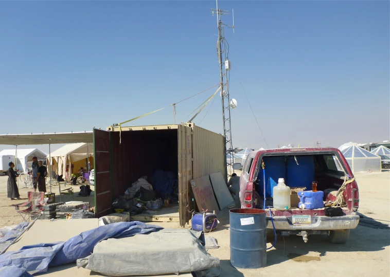 a couple people stand in an out door trailer