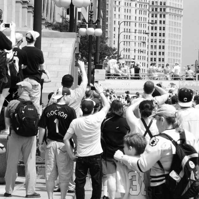 group of people standing next to steps with buildings behind