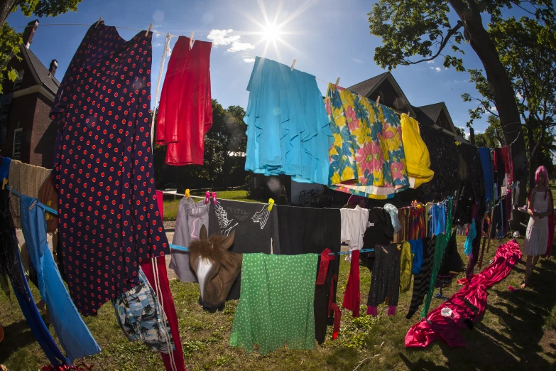 a clothes line with brightly colored items hanging outside