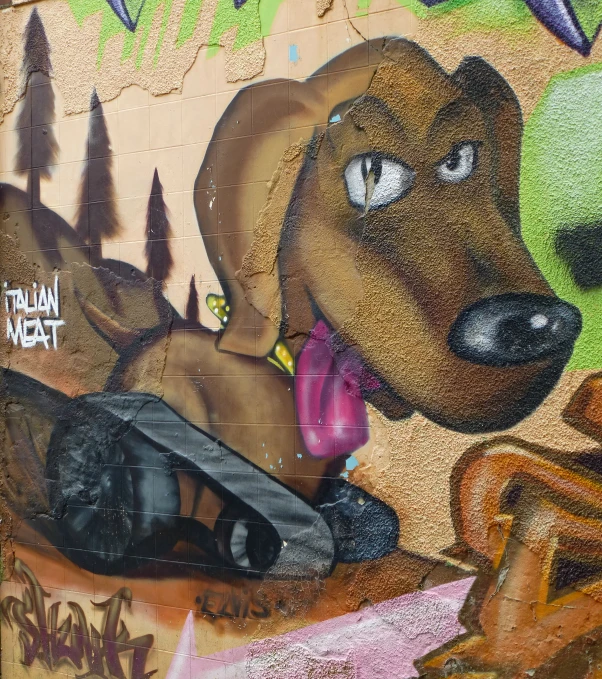 graffiti with a brown dog that is wearing a pink hat