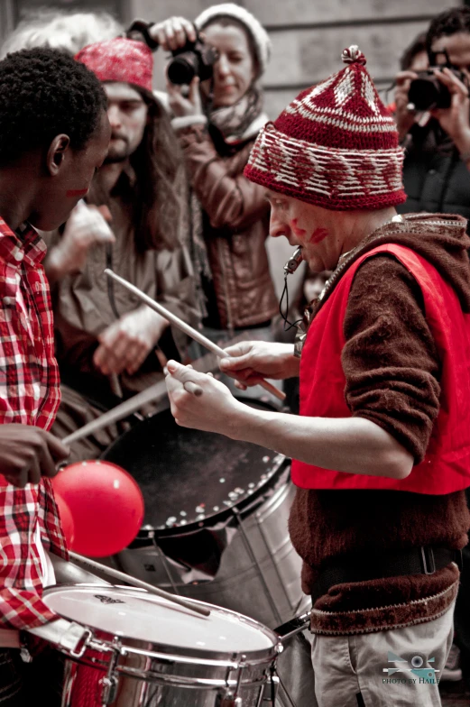 some people playing instruments and singing