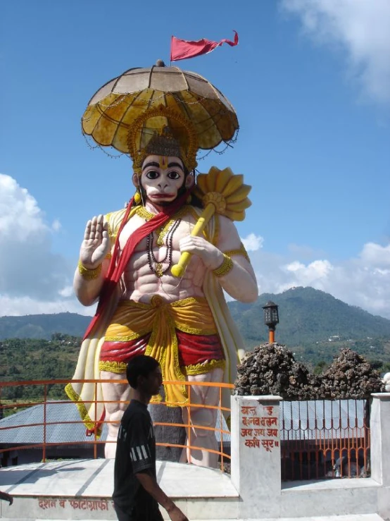 a large statue with many faces on display