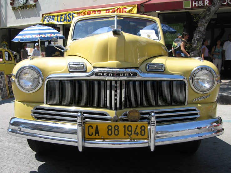 an old car that is in a parking lot