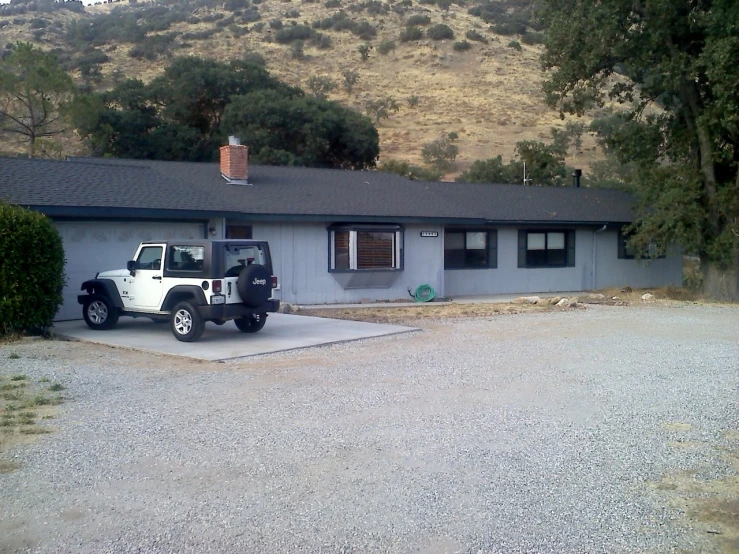 a truck is parked outside of a house