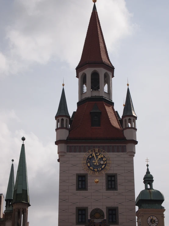 the clock tower is showing 2 40 on a cloudy day