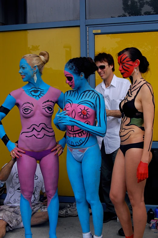 the body paint of several women is being shown