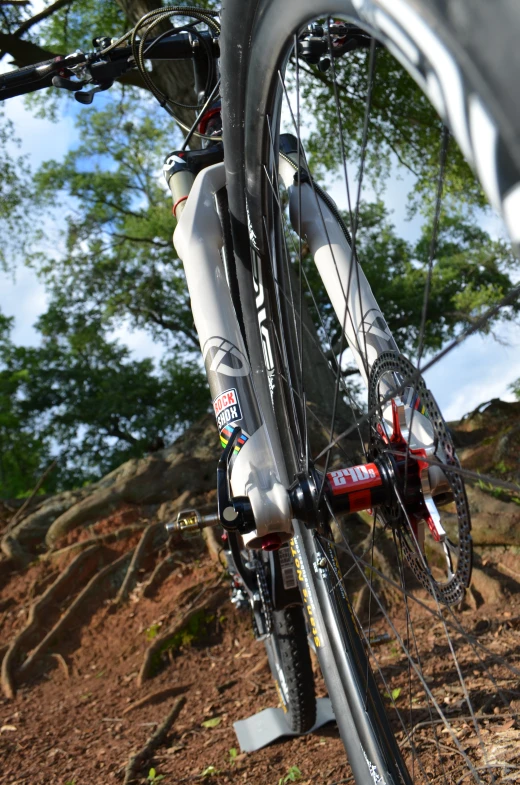 a bicycle has been parked on the dirt