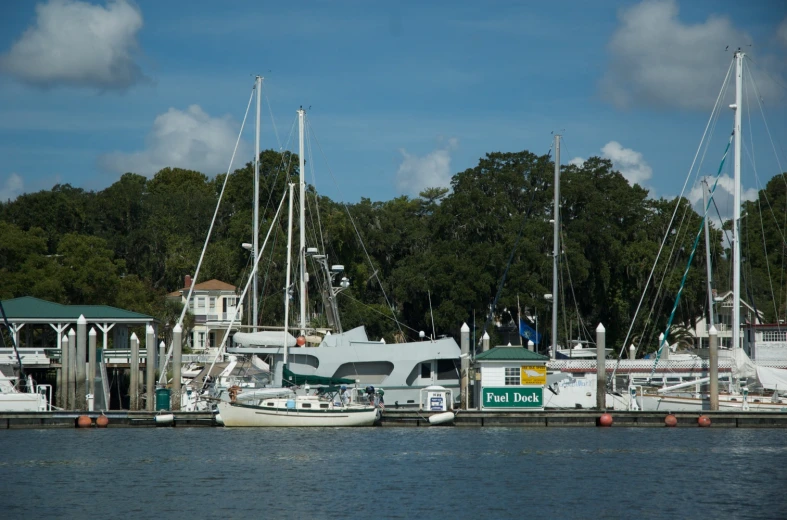 several boats are docked near a dock