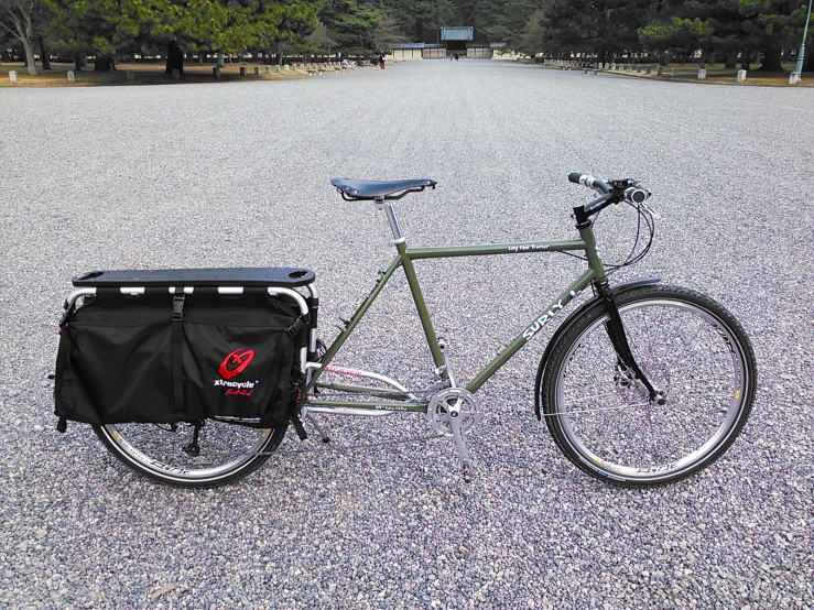 a bicycle with an extra bike seat in a parking lot