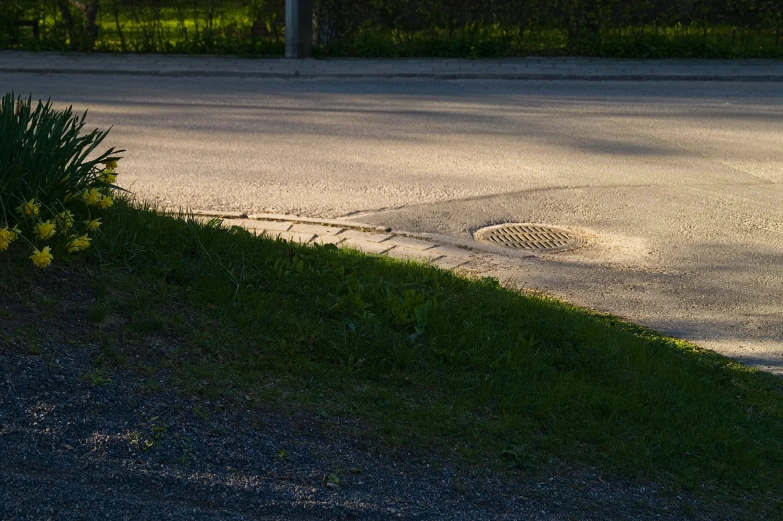 an open parking lot next to the road