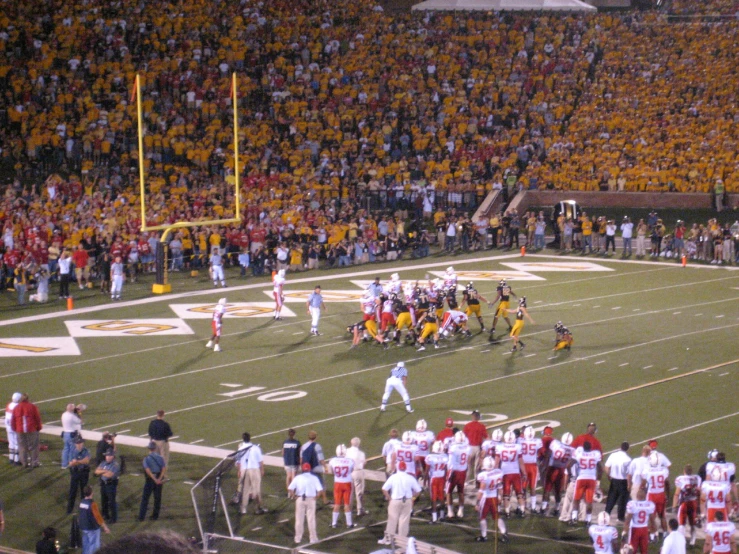 a large football field with a bunch of people