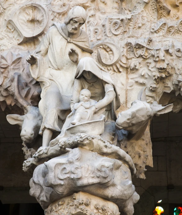 an ancient sculpture showing a woman holding a bird, with a man riding a horse on one end