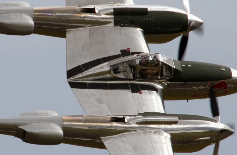 two silver planes are seen in a line