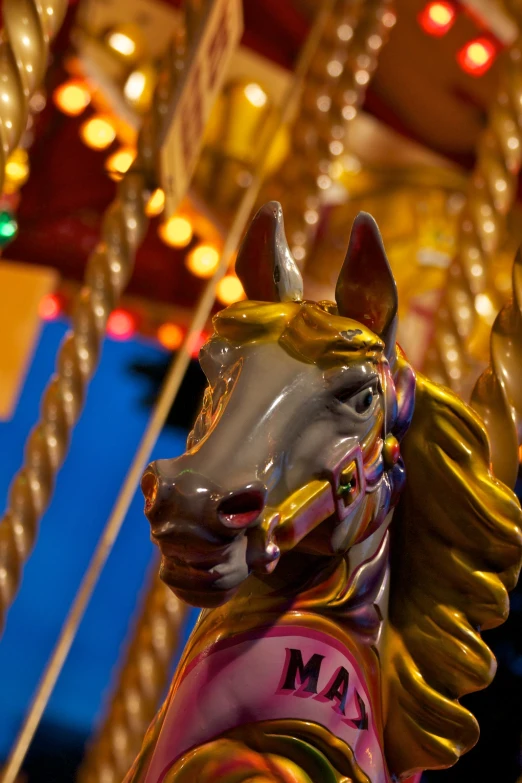 an image of a merry go round with lights in the background