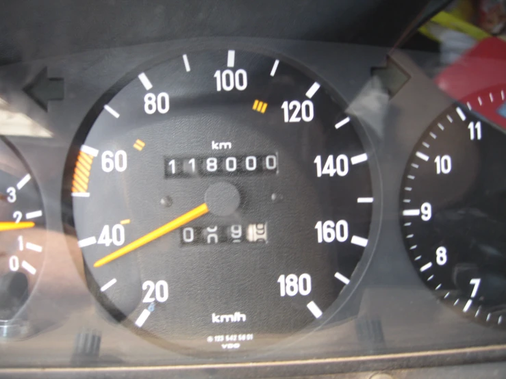 a few gauges on a car, with one number on the dash