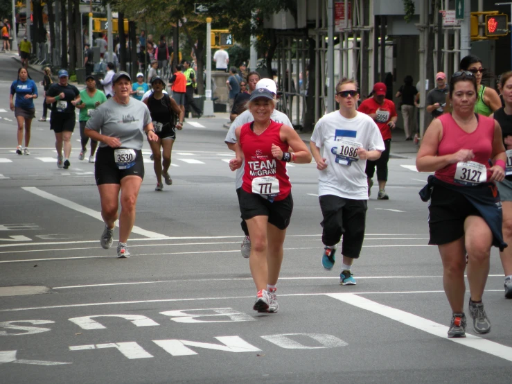 group of people in a street running together