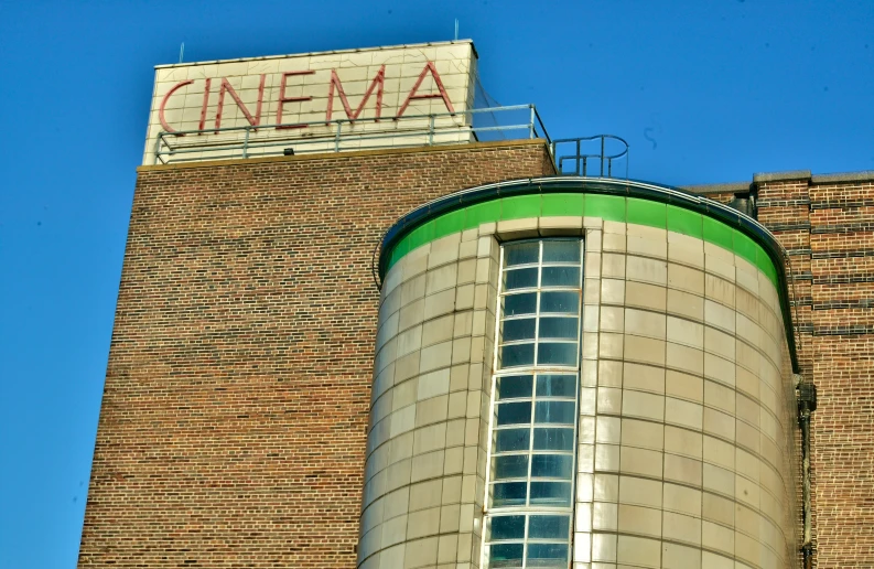 a tall building with a large sign on top of it