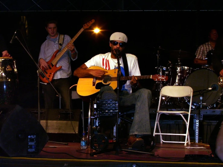 some musicians playing music together on a stage