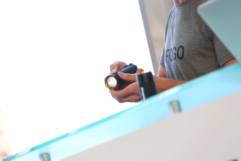 a man working on some electronics inside a building