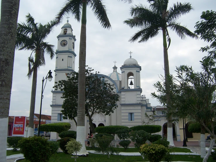 a large building with many trees around it