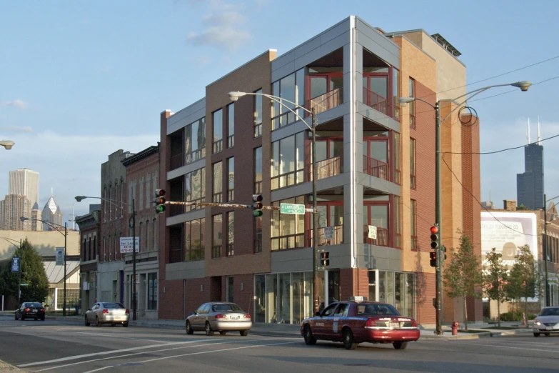 a city street scene showing a very large brick building